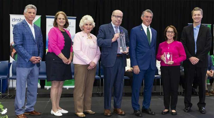 Governor John C. Carney, Jr., receives the Paul K. Weatherly Award from the Delaware Tech Board of Trustees. From left to right: Robert E. Hagerty (trustee), Lolita A. Lopez (trustee), Gov. Carney, Michael J. Hare (trustee), Nancy J. Shevock (chairman, Board of Trustees), Diane F. Glenn (trustee), President Mark T. Brainard.